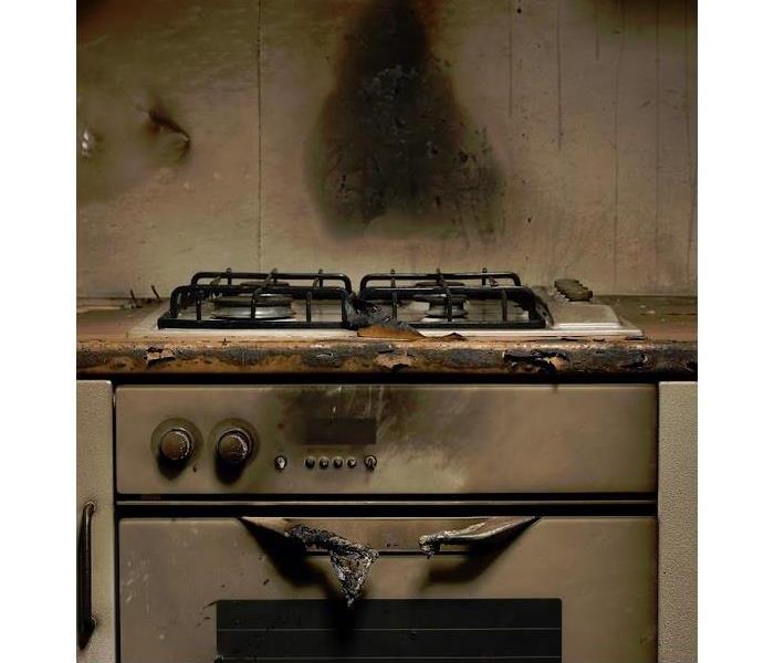 oven covered with smoke and soot