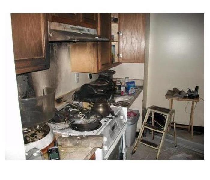 A kitchen stovetop that caught on fire